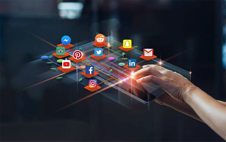 Hand touching a digital interface displaying various social media platform icons